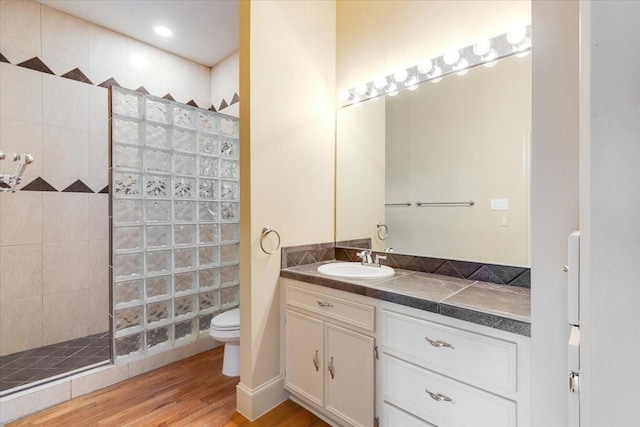 1020 Columbus St, Houston, TX 77019 - full bathroom with walk in shower, vanity, and wood finished floors