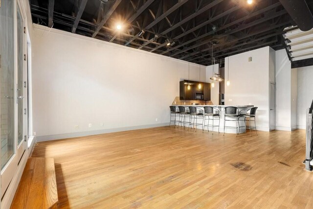1020 Columbus St, Houston, TX 77019 - bar area with light wood finished floors and hanging light fixtures