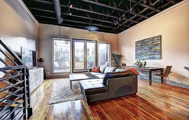 1020 Columbus St, Houston, TX 77019 - living area featuring hardwood / wood-style floors, french doors, and rail lighting