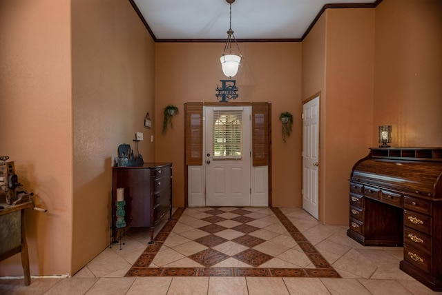 925 Royal Rd, Port Lavaca, TX 77979 - entrance foyer featuring light tile patterned floors, ornamental molding, and a high ceiling