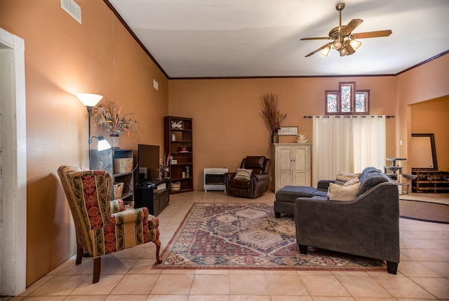925 Royal Rd, Port Lavaca, TX 77979 - living room with a ceiling fan, crown molding, and light tile patterned floors