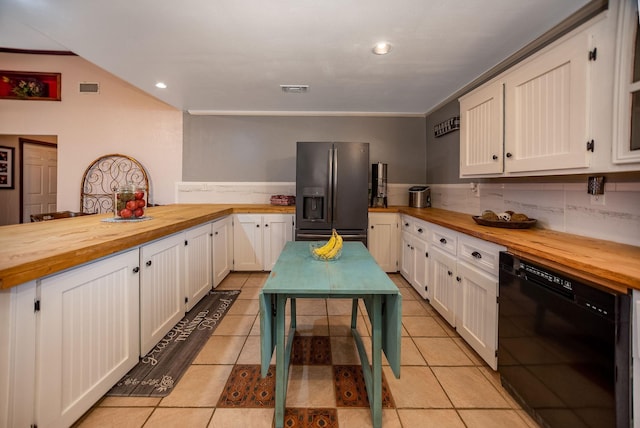 925 Royal Rd, Port Lavaca, TX 77979 - kitchen with butcher block countertops, stainless steel fridge, black dishwasher, white cabinetry, and a peninsula