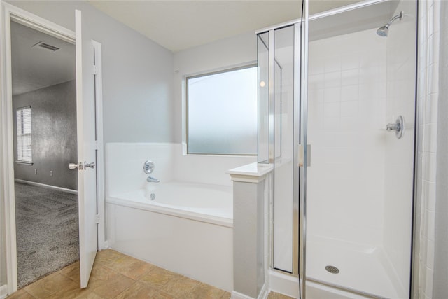 7255 Liberty Mesa Ln, Houston, TX 77049 - full bath featuring a stall shower and a bath
