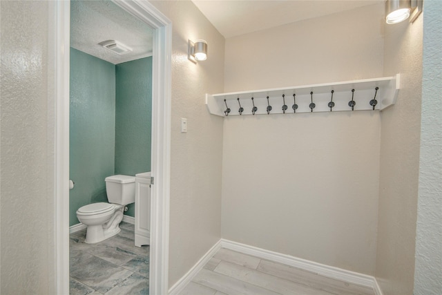 7255 Liberty Mesa Ln, Houston, TX 77049 - bathroom with toilet and baseboards