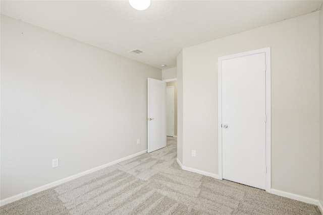 7255 Liberty Mesa Ln, Houston, TX 77049 - unfurnished bedroom featuring light carpet and baseboards