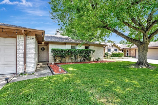 15707 Spring Forest Dr, Houston, TX 77059 - single story home with brick siding, a front lawn, a chimney, and a garage