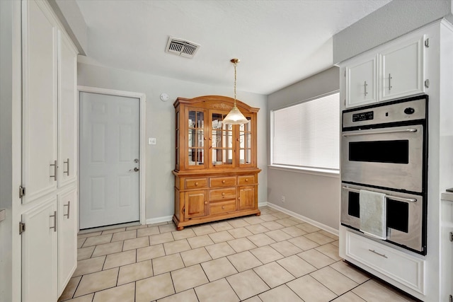 15707 Spring Forest Dr, Houston, TX 77059 - kitchen with double oven, white cabinetry, and pendant lighting