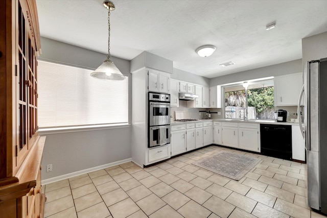 15707 Spring Forest Dr, Houston, TX 77059 - kitchen featuring stainless steel appliances, light countertops, white cabinetry, under cabinet range hood, and hanging light fixtures