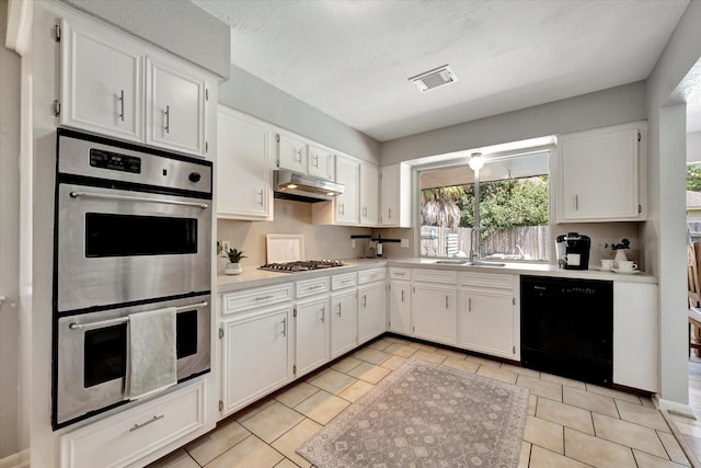15707 Spring Forest Dr, Houston, TX 77059 - kitchen featuring appliances with stainless steel finishes, white cabinets, light countertops, and light tile patterned floors