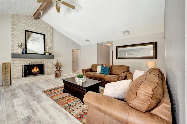15707 Spring Forest Dr, Houston, TX 77059 - living area featuring ceiling fan, a brick fireplace, wood finished floors, and a textured ceiling