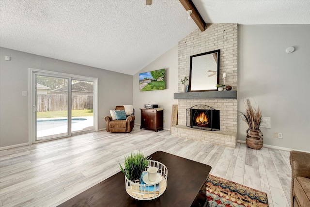 15707 Spring Forest Dr, Houston, TX 77059 - living room with wood finished floors, a fireplace, and a textured ceiling