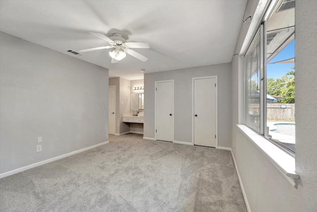 15707 Spring Forest Dr, Houston, TX 77059 - unfurnished bedroom with light colored carpet, access to outside, multiple closets, and ensuite bath