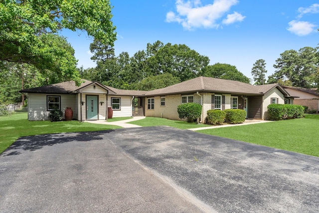 32047 S Wiggins St, Magnolia, TX 77355 - single story home featuring a front lawn and a shingled roof