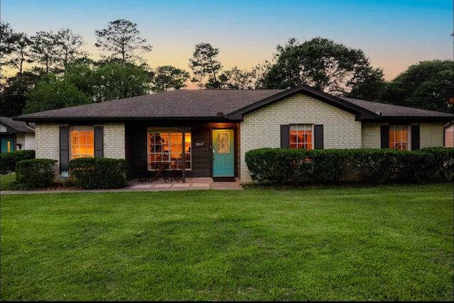 32047 S Wiggins St, Magnolia, TX 77355 - single story home featuring a front lawn and brick siding