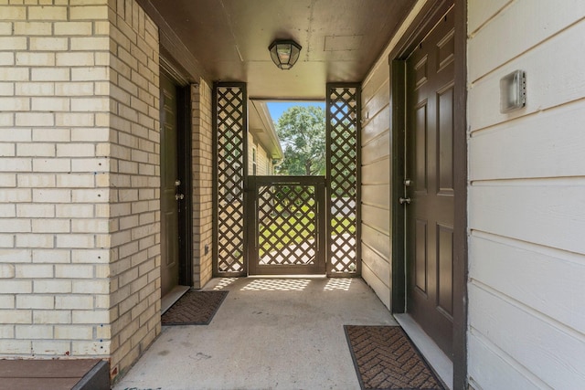 32047 S Wiggins St, Magnolia, TX 77355 - doorway to property featuring brick siding
