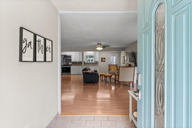32047 S Wiggins St, Magnolia, TX 77355 - entrance foyer with light tile patterned floors and a ceiling fan