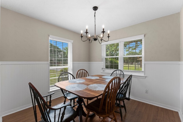 32047 S Wiggins St, Magnolia, TX 77355 - dining room with a chandelier, a wainscoted wall, and wood finished floors
