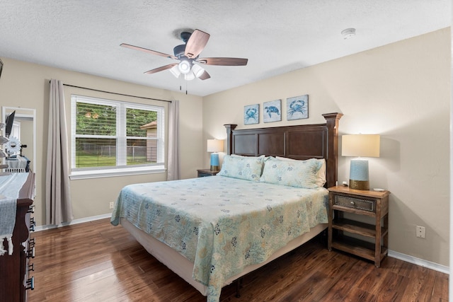 32047 S Wiggins St, Magnolia, TX 77355 - bedroom featuring dark wood-type flooring, a ceiling fan, and a textured ceiling
