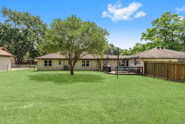 32047 S Wiggins St, Magnolia, TX 77355 - rear view of house with a fenced backyard and brick siding