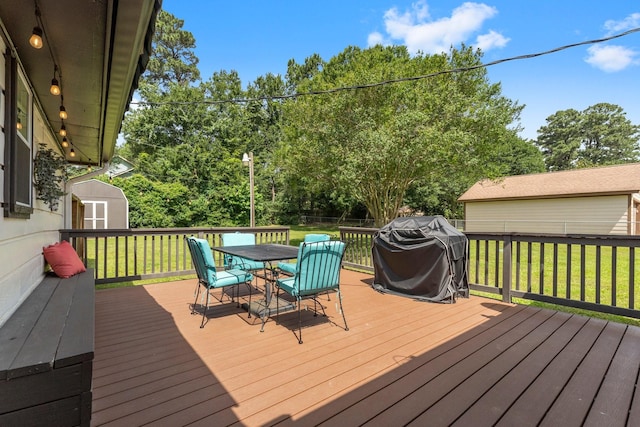 32047 S Wiggins St, Magnolia, TX 77355 - deck with a storage shed, area for grilling, outdoor dining area, a fenced backyard, and view of scattered trees