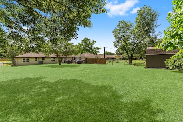 32047 S Wiggins St, Magnolia, TX 77355 - view of yard with a storage unit