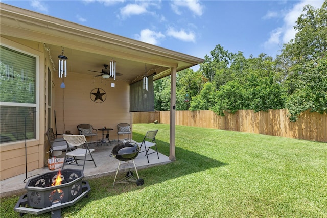 18715 Deer Trace Dr, Crosby, TX 77532 - view of yard featuring an outdoor fire pit, a patio, and a ceiling fan