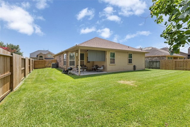 18715 Deer Trace Dr, Crosby, TX 77532 - back of property with a patio area and a fenced backyard