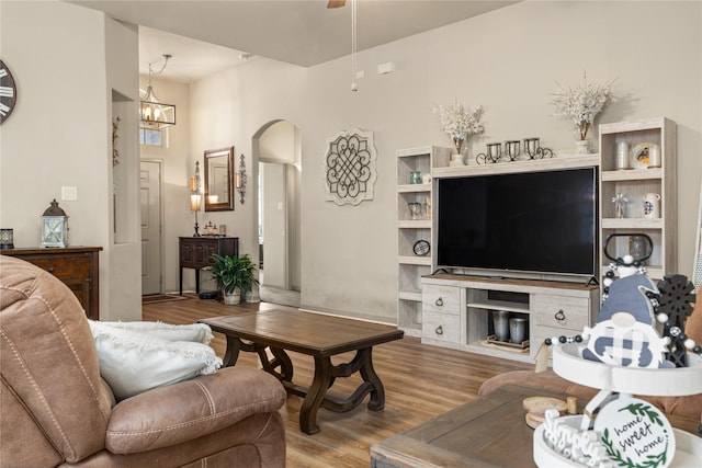 18715 Deer Trace Dr, Crosby, TX 77532 - living area with arched walkways, wood finished floors, and a ceiling fan