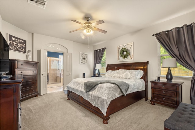 18715 Deer Trace Dr, Crosby, TX 77532 - bedroom with light carpet, ensuite bath, and a ceiling fan