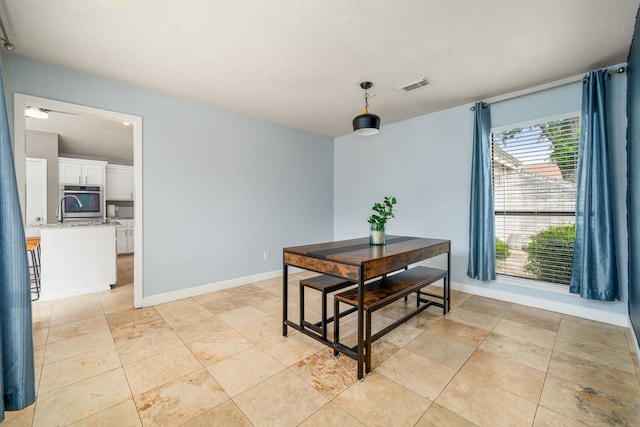 6115 Downwood Forest Dr, Houston, TX 77088 - dining area featuring baseboards