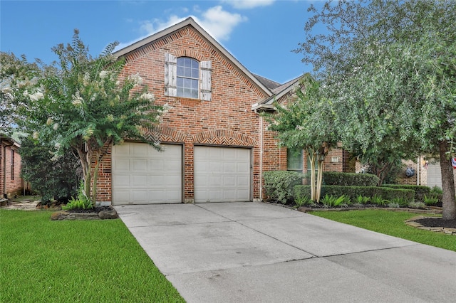 14314 Prosper Ridge Dr, Cypress, TX 77429 - traditional-style house featuring brick siding, driveway, an attached garage, and a front yard