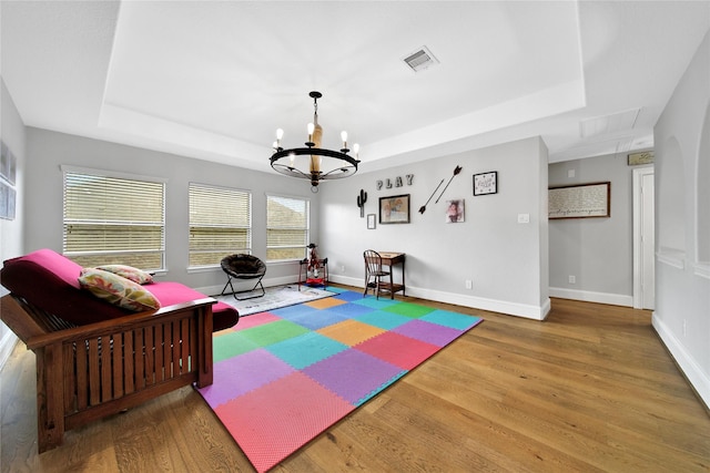 14314 Prosper Ridge Dr, Cypress, TX 77429 - game room featuring a raised ceiling, attic access, wood finished floors, and a chandelier