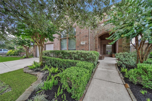 14314 Prosper Ridge Dr, Cypress, TX 77429 - obstructed view of property featuring brick siding, a garage, and driveway