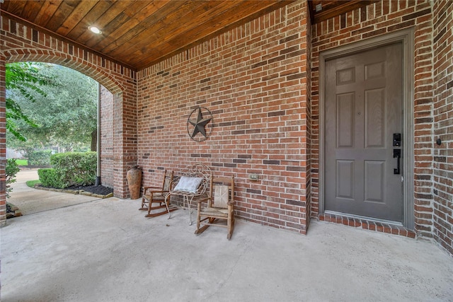 14314 Prosper Ridge Dr, Cypress, TX 77429 - view of exterior entry with brick siding and a patio area