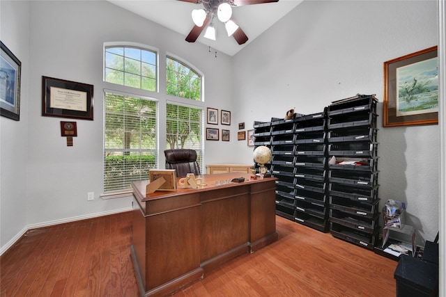 14314 Prosper Ridge Dr, Cypress, TX 77429 - home office with ceiling fan, wood finished floors, and high vaulted ceiling