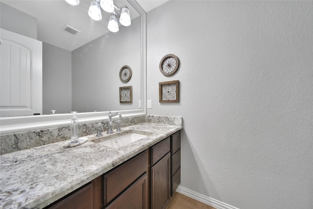 14314 Prosper Ridge Dr, Cypress, TX 77429 - bathroom featuring vanity, a textured wall, and tile patterned floors