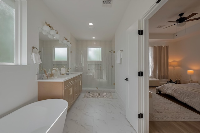 776 Mansfield St, Houston, TX 77091 - full bath featuring ensuite bath, a shower stall, double vanity, a soaking tub, and recessed lighting