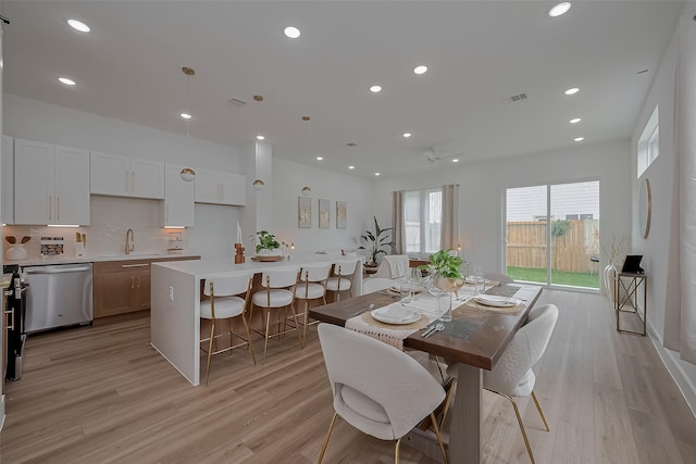 776 Mansfield St, Houston, TX 77091 - dining room with light wood-style floors and recessed lighting