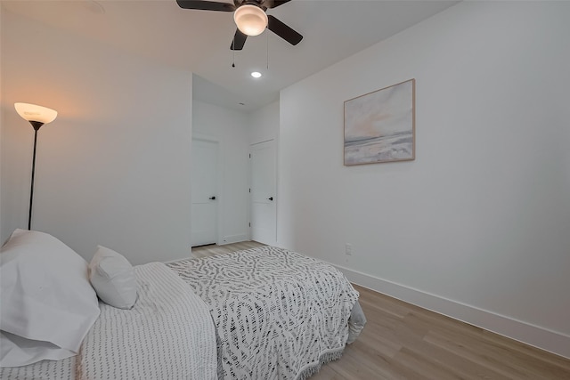 776 Mansfield St, Houston, TX 77091 - bedroom featuring light wood-type flooring, a ceiling fan, and recessed lighting