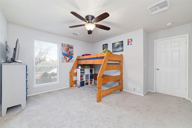 18914 Woodglen Shadows Dr, Humble, TX 77346 - carpeted bedroom with baseboards and a ceiling fan