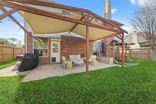 18914 Woodglen Shadows Dr, Humble, TX 77346 - back of property with brick siding, a chimney, a fenced backyard, and a patio