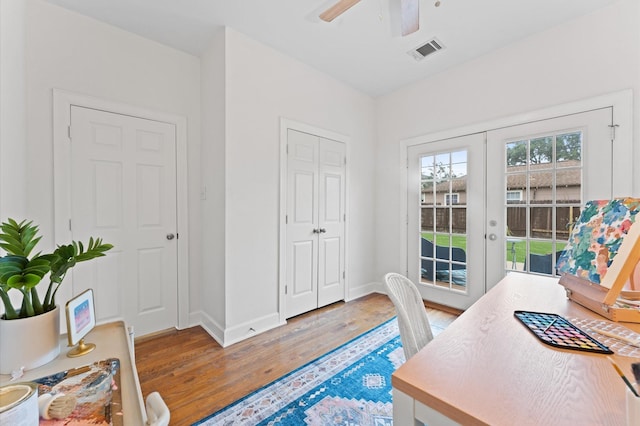 2909 Arbor St, Houston, TX 77004 - home office featuring light wood-style flooring, french doors, and a ceiling fan