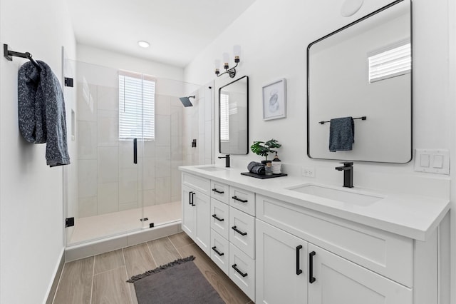 2213 Springwood Vista Ln, Houston, TX 77055 - full bath featuring double vanity, a shower stall, and recessed lighting