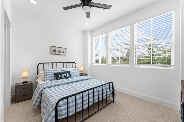 2213 Springwood Vista Ln, Houston, TX 77055 - carpeted bedroom with multiple windows, recessed lighting, and a ceiling fan
