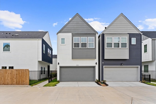 2213 Springwood Vista Ln, Houston, TX 77055 - view of front facade with concrete driveway and a garage