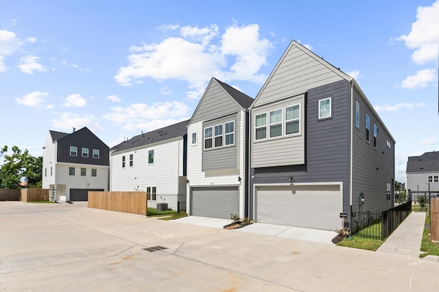 2213 Springwood Vista Ln, Houston, TX 77055 - view of property exterior featuring driveway and a garage