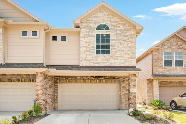 527 Dr Martin Luther King Jr Dr Unit D, La Porte, TX 77571 - townhome / multi-family property featuring an attached garage, driveway, and brick siding