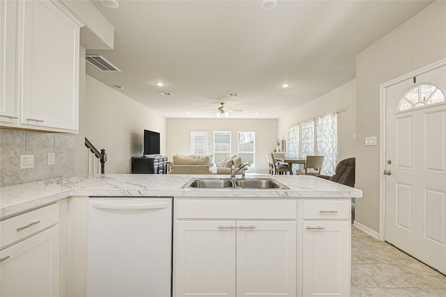527 Dr Martin Luther King Jr Dr Unit D, La Porte, TX 77571 - kitchen featuring white dishwasher, open floor plan, ceiling fan, tasteful backsplash, and a peninsula