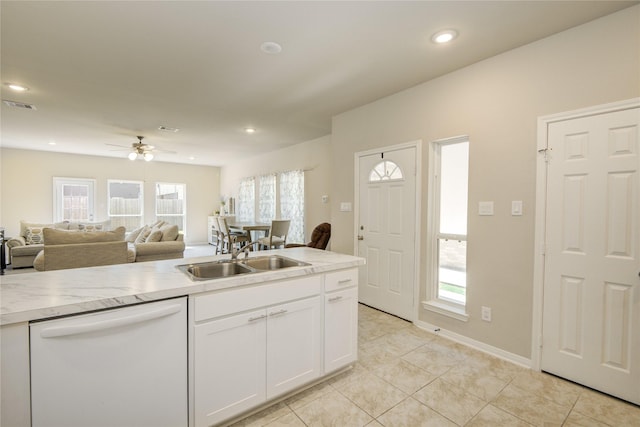 527 Dr Martin Luther King Jr Dr Unit D, La Porte, TX 77571 - kitchen featuring white dishwasher, light tile patterned flooring, white cabinets, light countertops, and recessed lighting
