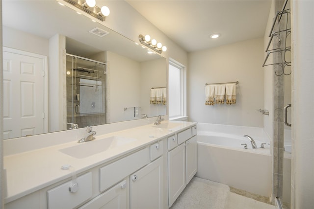 527 Dr Martin Luther King Jr Dr Unit D, La Porte, TX 77571 - bathroom featuring double vanity, a stall shower, a garden tub, tile patterned flooring, and recessed lighting